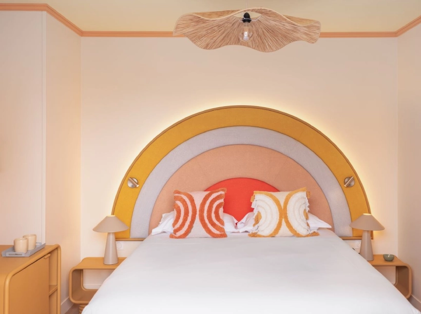 Family room at Nice Pam Hotel in Nice with colorful headboard and retro atmosphere